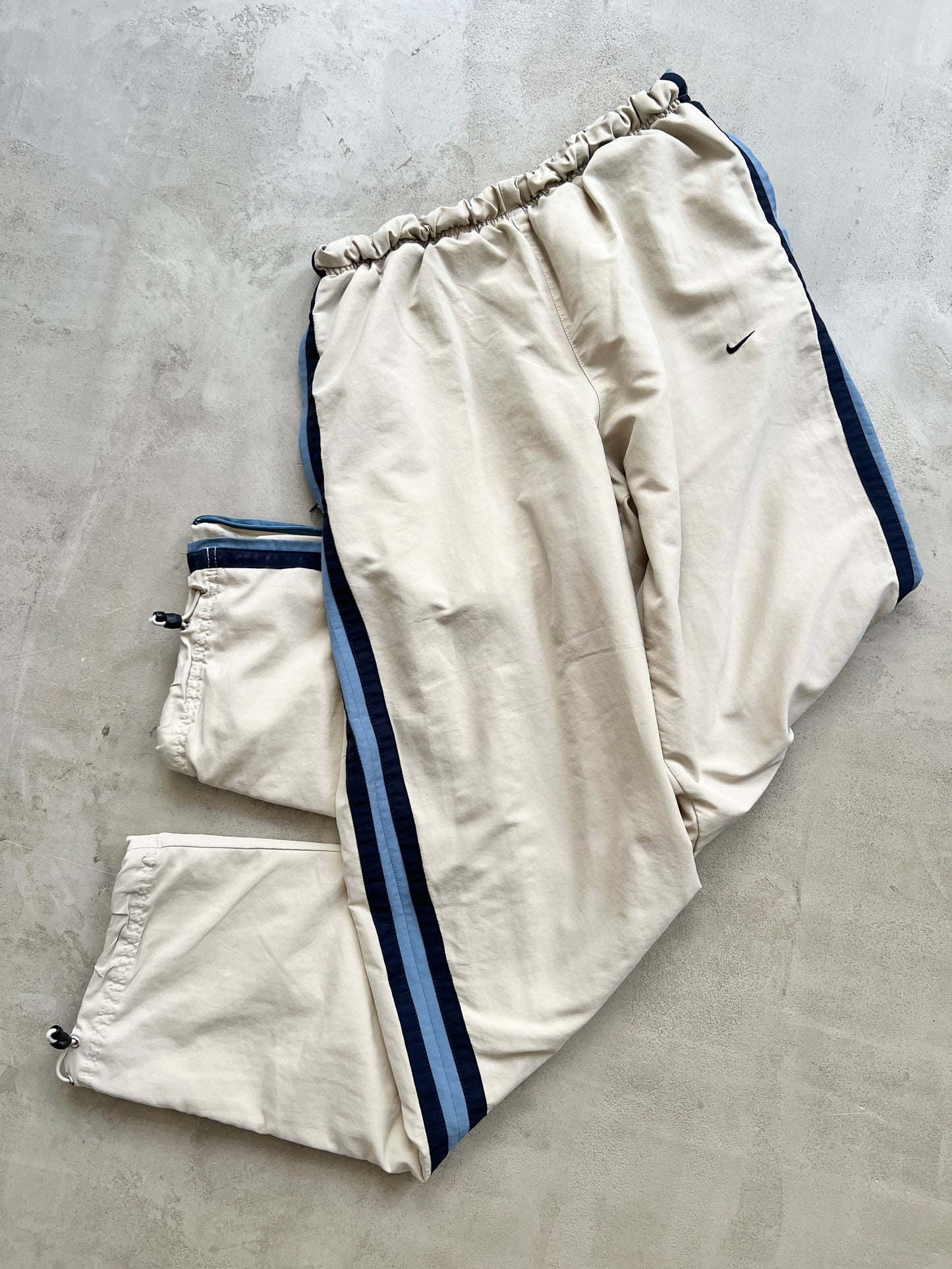 LIGHT BEIGE/BLUE NIKE TRACK PANTS - 2000S - M/L